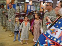 Photo by Rick ScavettaCol. Bryan DeCoster (left), commander of U.S. Army Garrison Rheinland-Pfalz, dances with community members, including 
Capt. Phillip Castillo from New Mexico’s Pueblo tribe and Castillo’s daughters, Lia and Madeline. Sandra Namingha (right) and her husband, Lindbergh, taught the community traditional Native American dancing and songs during the National Native American Heritage Month event Nov. 15 at the Kazabra Club on Vogelweh.