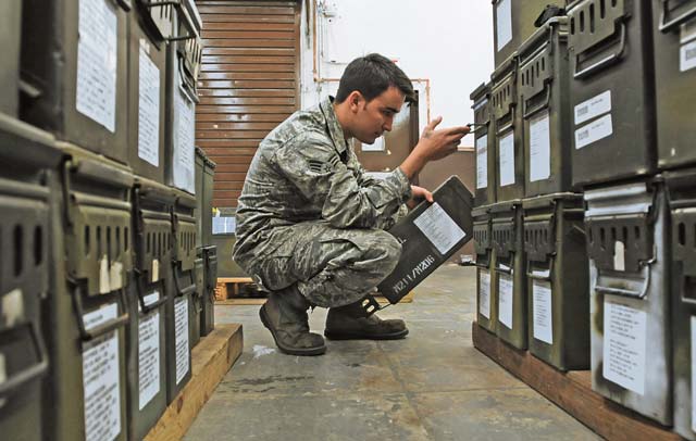 Senior Airman Bryan Sandt, 86th Munitions Squadron maintenance crew chief, makes sure numbers match up on ammunition cans to prepare for a 100 percent accountability inspection Feb. 13 on Ramstein. The conventional maintenance shop is in charge of maintaining shelf and service life on countermeasures used in C-130J Super Hercules. They also perform storage monitoring inspections on in-line items kept within the munitions storage area.