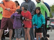 Amaya Ennes, 7, Lia Castillo, 9, and Madeline Castillo, 7, await the start of the Doggie Dash 5K run.