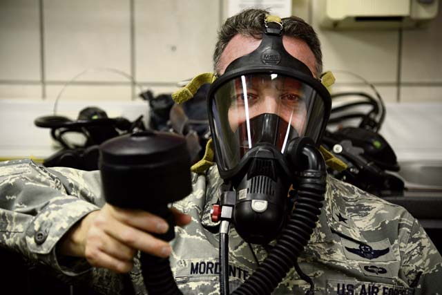 Brig. Gen. Patrick X. Mordente, 86th Airlift Wing commander, does a breathing test with the MSA FireHawk  mask prior to participating in a burn house training scenario Nov. 19 on Ramstein. The FireHawk is the mask used by 86th Civil Engineer Squadron firefighters when battling fires.