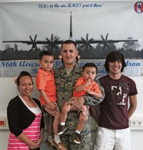 Senior Master Sgt. Jonathan Wilkins and wife Gina, pose for a photo with their sons, Einey, Miney and Miney Mo July 27 on Ramstein. Wilkins is scheduled to deploy in August for a 365-day TDY, making this his third deployment and second short tour. His wife Gina is pregnant with a girl and will be giving birth in November. 