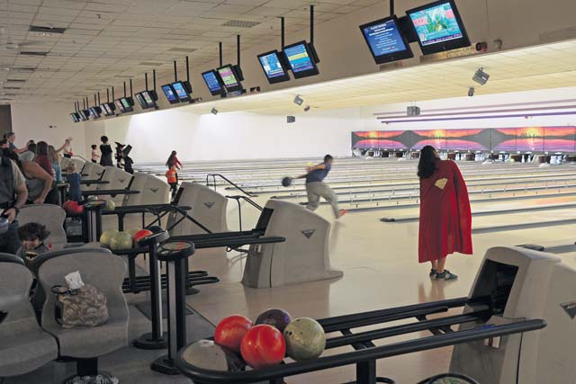 Photo by Senior Airman Jose L. LeonFamilies of deployed service members gather to bowl during the Deployed Families “Boo” Bowling Night Oct. 24 at the Vogelweh Bowling Center. The Airman & Family Readiness Center organized the bowling night as an opportunity for families to get together, build friendships and provide support.