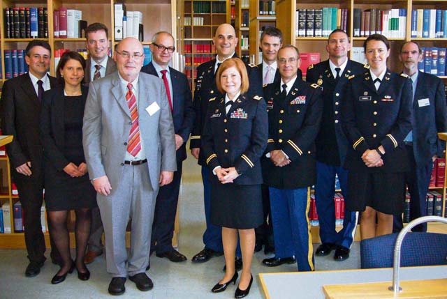 Photo by Stephen W. Smith American and German jurists pose for a photo in the library of the Saarbrücken state court during the 21st Theater Sustainment Command’s Office of the Staff Judge Advocate legal exchange visit to the court April 17.