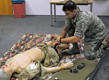 Staff Sgt. Antonio Sixto, 86th Medical Operations Squadron NCO in charge of emergency responses, demonstrates how to apply a combat application tourniquet during a self-aid and buddy care hands-on class Oct. 7 on Ramstein.