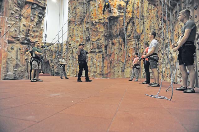 Michael Giesey, 86th Force Support Squadron Outdoor Recreation aid, teaches a class of students how to properly belay climbers Nov. 5 on Ramstein. Outdoor Recreation offers an assortment of classes from paddle-boarding to rock climbing.