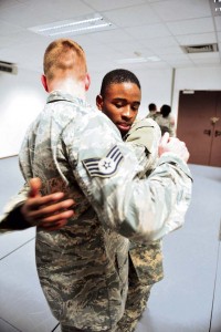 Pfc. Devante Lester, air defense Soldier assigned to the 10th Army Air and Missile Defense Command’s 5th Battalion 7th Air Defense Artillery, practices takedowns with an Airman from the 86th Security Forces Squadron during a Basic Combatives Course Jan. 13 on Ramstein.