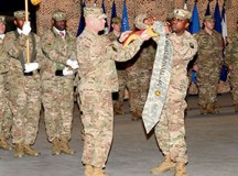 Lt. Col. Michael S. Knapp, commander of the 39th Transportation Battalion (Movement Control) of the 21st Theater Sustainment Command’s 16th Sustainment Brigade, and Command Sgt. Maj. Gussie B. Bellinger, command sergeant major of the 39th Trans. Bn., case their battalion flag during a ceremony Feb. 22 on Rhine Ordnance Barracks.
