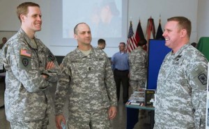 (From left) Capt. Paul Barnett, operations officer with the 457th Civil Affairs Battalion, 7th Civil Support Command, jokes with Command Sgt. Maj. Ray Brown, 457th CA Bn., 7th CSC senior enlisted leader, and Maj. Rick Murphy, 361st CA Brigade, 7th CSC operations officer, during the 7th CSC hosted U.S. Army Reserve birthday event Tuesday at the Kaiserslautern Military Community Center food court on Ramstein.
