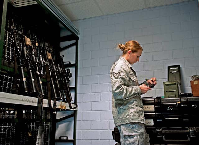 Staff Sgt. Bobbi Shackelford, 10th Allied Expeditionary Air Force medical logistics specialist, performs a weapons check on pistols stored in the armory. Not only does the armory store weapons for the 86th Security Forces Squadron, it also stores weaponry for other base units and service members who are on temporary duty. 