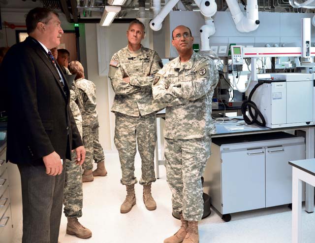 Photo by Ed DrohanHeinz Stahl (left), U.S. Public Health Command Region-Europe laboratory director, points out some of the new features in the unit’s renovated soil testing laboratory at Landstuhl Regional Medical Center to Col. Randall Rietcheck (center), PHCR-E deputy commander, and Brig. Gen. Norvell Coots (right), Europe Regional Medical Command commander, after a ceremony dedicating the facility Oct. 15. The labs, which conduct soil and water testing for units throughout Europe, Africa and the Middle East, are housed in a building that was originally built as a barracks for the German army in 1938. The ceremony also dedicated the new customer service wing to Dr. Charles Statham, who was the laboratory director for more than 20 years before retiring recently.