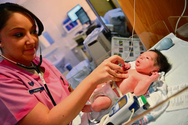Photo by Tech. Sgt. Daylena RicksStaff Sgt. Tara Zamora, 86th Medical Squadron medical technician, checks the temperature of an infant at Landstuhl Regional Medical Center. LRMC is the largest American hospital outside of the U.S.