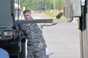 Senior Airman Matthew Dankiewicz, 86th Munitions Squadron munitions storage crew member, spots a vehicle to ensure munitions are loaded safely onto a trailer Aug. 22 on Ramstein.