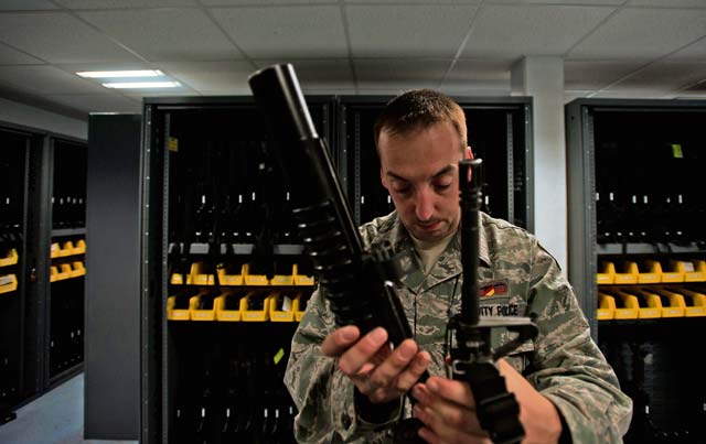ZB-6 Neils Hanss, 86th Security Forces Squadron assistant NCO in charge of the armory,  attaches an M-203 grenade launch to an M-4 assault rifle Oct. 24 on Ramstein. The Airmen in charge of the armory ensure all equipment is distributed to the appropriate individuals and that it is returned properly at the end of duty shifts. 