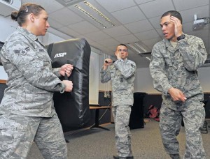 Tech. Sgt. Christopher Ricks (right), 86th Security Forces Squadron instructor, teaches proper technique when utilizing the ASP baton to Airmen April 11 on Ramstein. The 86th SFS and the 569th U.S. Forces Police Squadron came together to train Airmen in verbal judo.