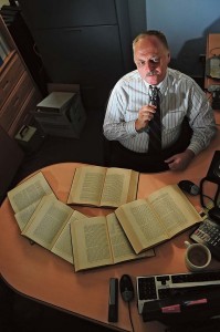 Silvano Wueschner, 86th Airlift Wing historian, sifts through books in his office Sept. 25 on Ramstein. Wueschner has been a historian at Ramstein since June 2011. He captures and organizes the history of the base.
