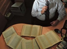 Silvano Wueschner, 86th Airlift Wing historian, sifts through books in his office Sept. 25 on Ramstein. Wueschner has been a historian at Ramstein since June 2011. He captures and organizes the history of the base.