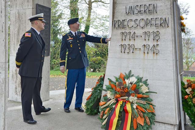 Photo by Rick ScavettaLt. Col. George Brown (right), U.S. Army Garrison Rheinland-Pfalz’s director of emergency services, and Andreas Grawert, the garrison’s deputy fire chief, pay their respects to fallen German soldiers during a Nov. 17 ceremony in Otterbach for “Volkstrauertag,” the people’s day of mourning. Garrison Commander Col. Bryan DeCoster took part in a wreath laying at the cemetery in Kaiserslautern, while Command Sgt. Maj. Kenneth Kraus, the garrison’s senior enlisted leader, took part in a ceremony in Germersheim. The public holiday in Germany commemorates all those who died in armed conflicts.