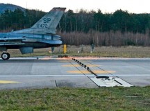 An F-16 Fighting Falcon from Spangdahlem Air Base runs through a test of a Barrier Arresting Kit-12 Jan. 28 on the Ramstein flightline. Safeguarding equipment and the lives of military personnel, the BAK-12 ensures a safe deceleration of landing aircraft within a few seconds.