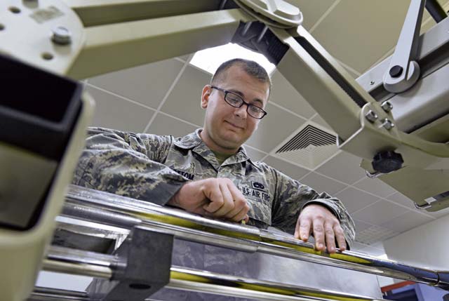 Senior Airman Jonathan Sidebottom, 86th Maintenance Squadron test measurement and  diagnostic equipment technician, adjusts a screw on a 1,000 pound torque wrench.