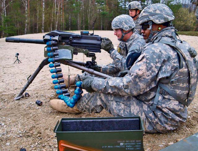 Pfc. Andrew J. Smith (center) and Spc. Douglas K. Piper (front), both from 1st Platoon, 406th Human Resources Company, 21st Theater Sustainment Command’s 7th Civil Support Command, make elevation adjustments to the MK19 grenade launcher while Staff Sgt. Travis J. Helms (rear) ensures safe-range operations during qualification in a field exercise April 20  at Grafenwöhr Training Area. The exercise emphasized convoy operations, weapons qualification, unit cohesion and Soldier fitness. 