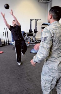 Senior Airman James Harrod, 693rd Intelligence, Surveillance and Reconnaissance Group operations training manager, catches a weighted ball thrown by Staff Sgt. Mario Jimenez, 86th Medical Operations Squadron Physical Therapy technician, during a physical therapy session Aug. 18 on Ramstein. The 86th MDOS physical therapy clinic can see active-duty patients for a variety of neuromuscular injuries, such as sprains, strains, rehabilitation after the  healing of a fracture and more. 