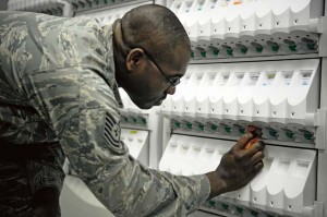 Tech Sgt. Elroy Plummer, 86th Medical Group pharmacy technician, uses a pill dispensing machine to collect medication May 31 on Ramstein. The 86th MDG pharmacy maintains readiness by providing the KMC with daily pharmaceutical needs and customer service.