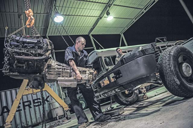 Senior Airman Christopher Moore, 386th Expeditionary Logistics Readiness Squadron vehicle mechanic, removes the engine of a truck July 18 at an undisclosed location in Southwest Asia. Moore has been a mechanic for the Air Force for three years and deployed from the 86th Vehicle  Readiness Squadron, Ramstein Air Base, in support of Operation Enduring Freedom.