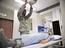Senior Airman Travis Pettis, 86th Medical Support Squadron radiology technologist, positions an X-ray tube over a simulated patient Sept. 24 on Ramstein. The 86th MDSS takes X-rays to detect broken bones, fractures and even illnesses such as pneumonia.