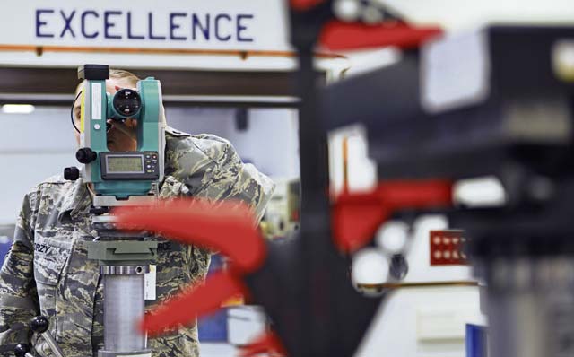 Tech. Sgt. Erin Zorzy, 86th Maintenance Squadron precision measurement equipment laboratory technician, looks through a scope to measure the temperature and accuracy of heat seeking missiles.