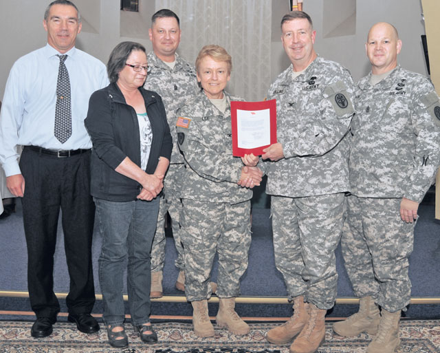 Photo by Phil A. JonesFrom left, Harry Raith, Henny Moll, Command Sgt. Maj. Timothy Sprunger, Col. Judith Lee,  Col. John Collins and Sgt. Major Brian Stauffer receive the MEDCOM Exceptional Organizational Safety Award.