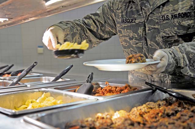Staff Sgt. Ruben Vasquez, 786th Force Support Squadron food service supervisor, serves food at the Rhineland Inn Dining Facility.