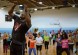 Tech. Sgt. Kedist Burnett, 86th Civil Engineering Squadron Airman Dorm Leader, leads an exercise on stage during a Bokwa class.