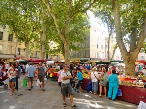 Shoppers scurry over the fresh food finds in Aix-en-Provence.