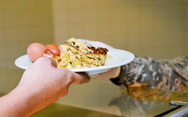 A customer of the Rhineland Inn Dining Facility receives food Oct. 7 on Ramstein. More than 700 service members visit the DFAC daily.