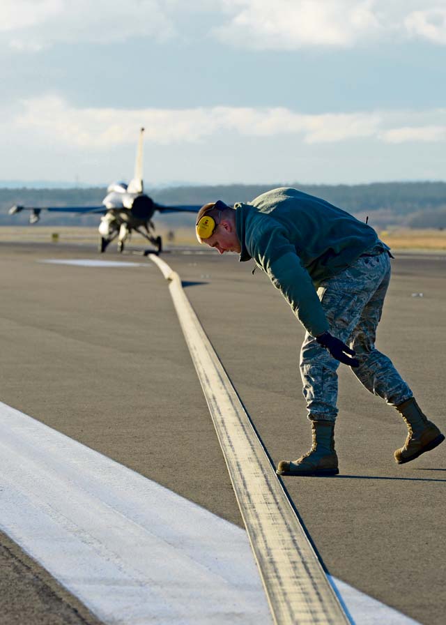 Senior Airman Jared Jones, 786th Civil Engineer Squadron power production journeyman, checks part of a Barrier Arresting Kit-12 for foreign object damage.