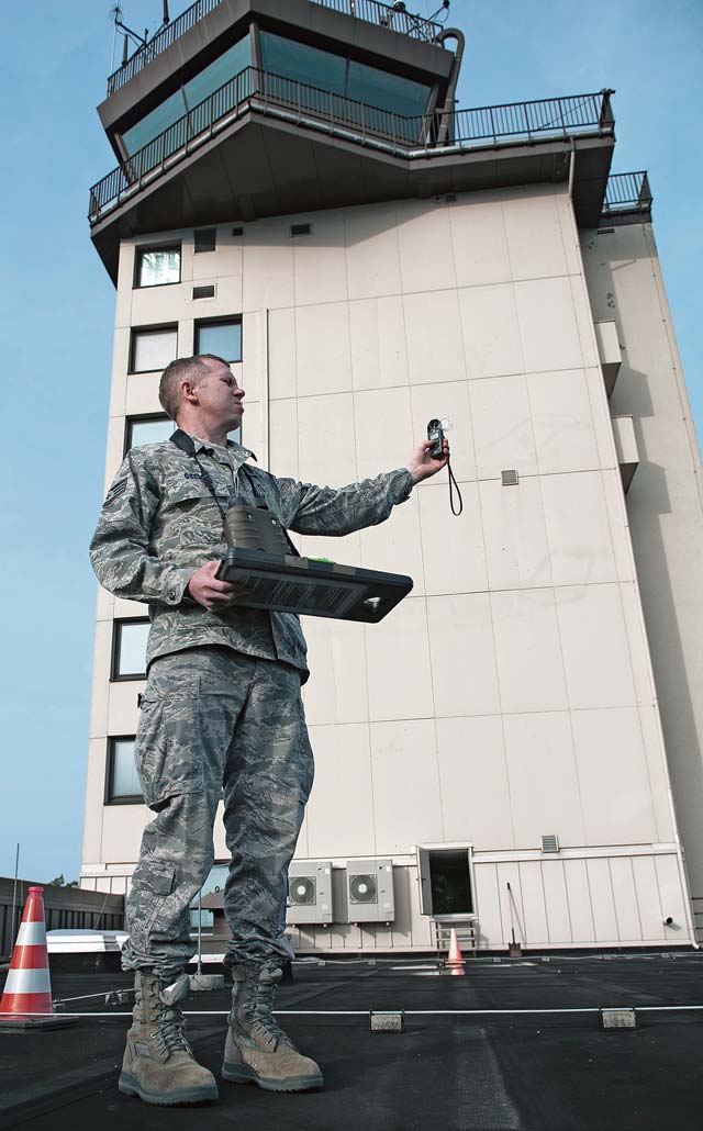 Staff Sgt. Albert Gsell, 86th Operations Support Squadron weather flight weather forecaster, operates a hand-held manual weather sensor Sept. 27 on Ramstein. The weather sensor is used as a backup to the primary weather sensors as a way to relay real-time data.