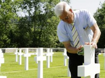 Retired Command Sgt. Maj. Dwight “Andy” Anderson, the Epinal American Cemetery superintendent, cleans a headstone July 8. Epinal American Cemetery and Memorial is the resting place of 5,255 U.S. Soldiers killed 
during World War II.