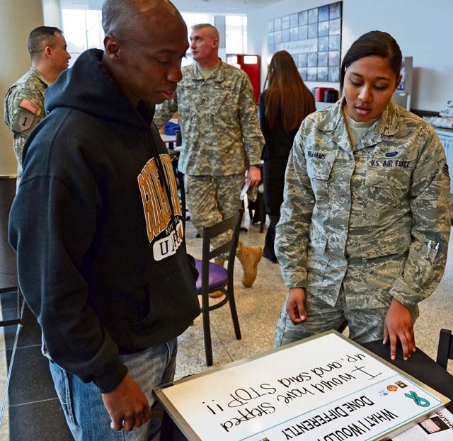 Tech. Sgt. Chris Willingham (left) from the 86th Aircraft Maintenance Squadron, 86th Airlift Wing, speaks with Senior Airman Andrea Williams, a victim advocate with the 86th Communications Squadron, about the sexual assault awareness program and what bystanders can do before a potential issue gets out of hand. Willingham wrote, “I would have stepped up and said ‘stop!’”