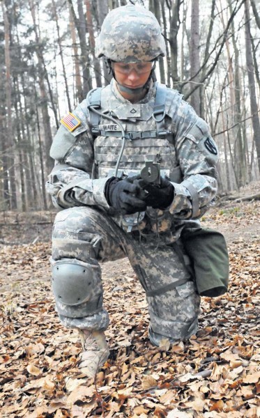 Pfc. Shane T. Waite, an intelligence analyst assigned to the  21st Theater Sustainment Command, checks his azimuth during the daytime land navigation portion of the 21st TSC’s 21st Special Troops Battalion Best Warrior Competition April 3 on Rhine Ordnance Barracks.