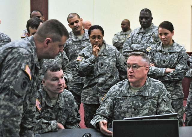 Soldiers from the 21st Theater Sustainment Command and the 7th Civil Support Command listen to guidance on foreign consequence management products from Col. Russell A. Henderson, the 7th CSC deputy commanding officer, during quarterly FCM training Nov. 19 on Daenner Kaserne. 