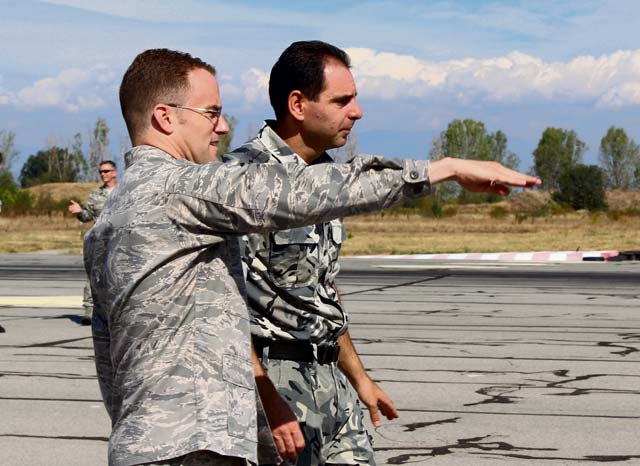 Courtesy photoCapt. Justin Rex, 435th Contingency Response Group air adviser, describes elements of the flightline to Capt. Nikolay Mateev, Bulgarian air force aeronautical engineer, during a recent course to introduce members of the Bulgarian air force to methods of installation planning and development at Graf Ignatievo Air Base, Bulgaria.