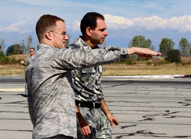 Courtesy photoCapt. Justin Rex, 435th Contingency Response Group air adviser, describes elements of the flightline to Capt. Nikolay Mateev, Bulgarian air force aeronautical engineer, during a recent course to introduce members of the Bulgarian air force to methods of installation planning and development at Graf Ignatievo Air Base, Bulgaria. 