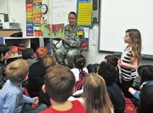 Lt. Col. Patricia K. Wright, 21st Theater Sustainment Command’s 21st Special Troops Battalion commander, reads “My Brother Charlie,” by Holly Robinson Peete, to a classroom of first-graders Feb. 7 at Kaiserslautern Elementary School on Vogelweh Military Complex.