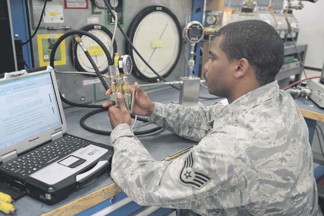 Photo by Tech. Sgt. James HodgmanStaff Sgt. Ricky Willard, 86th Maintenance Squadron  precision measurement laboratory craftsman, calibrates  an inflater kit, which is used to inflate aircraft  tires. 