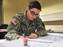 Pfc. Ashley N. Wyche, an intelligence analyst assigned to the 21st Theater Sustainment Command and native of Grovetown, Ga., creates a timeline of simulated terrorist activity during Critical Thinking, Structured Analysis training on Panzer Kaserne Nov. 21.