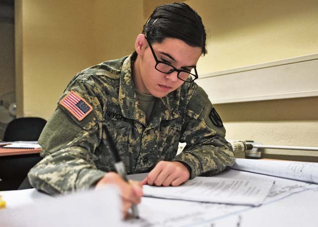 Pfc. Ashley N. Wyche, an intelligence analyst assigned to the 21st Theater Sustainment Command and native of Grovetown, Ga., creates a timeline of simulated terrorist activity during Critical Thinking, Structured Analysis training on Panzer Kaserne Nov. 21. 