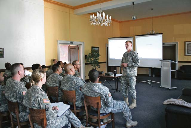 Col. Darren Werner, commander of 16th Sustainment Brigade, 21st Theater Sustainment Command, leads a discussion about team building during a command team training event held at the Rheinlander Club Sept 6.