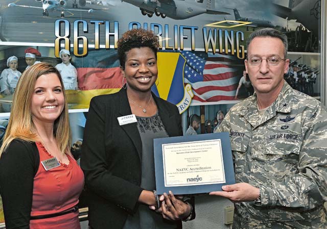 Photo by Airman 1st Class Jordan CastelanBrig. Gen. Patrick X. Mordente (right), 86th Airlift Wing commander, Shaquita Ponder (center), Airman and Family Services Flight deputy chief, and Stacy Jones (left), Ramstein Child Development Center director, pose with a National Association for  the Education of Young Children renewal accreditation certificate Monday on Ramstein. The accreditation certifies the Ramstein CDC until Oct. 1, 2018.