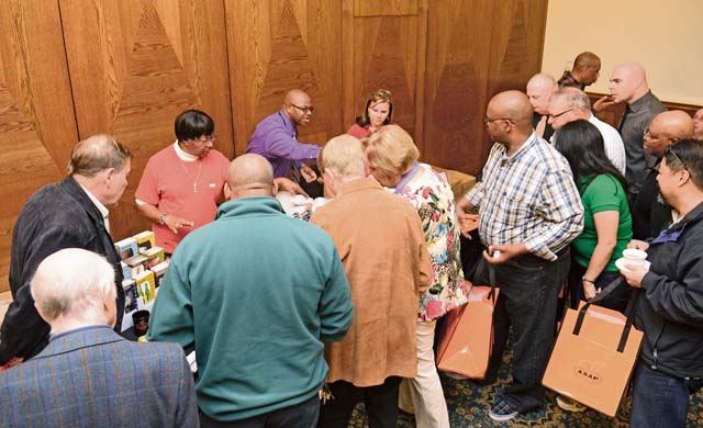 Retirees visit one of the informational booths set up for Retiree Appreciation Day Tuesday on  Ramstein. Organizations from the KMC gathered to relay information about changes to programs and answer questions from the audience.