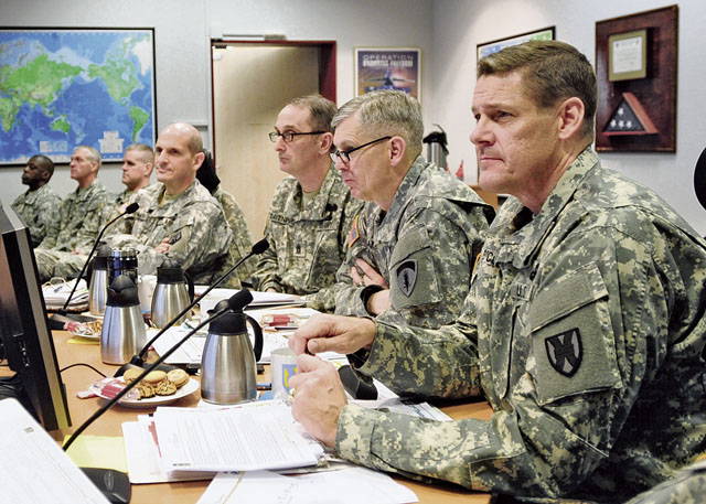 Photo by Spc. Iesha HowardMaj. Gen. John R. O’Connor (far right), commanding general of the 21st Theater Sustainment Command, Lt. Gen. Donald M. Campbell, commanding general of U.S. Army Europe, Command Sgt. Maj. David S. Davenport, command sergeant major of USAREUR, and Brig. Gen. Paul M. Benenati, commanding general of the 7th Civil Support Command, observe briefings given by subordinate unit leadership of the 21st TSC Dec. 10 on Panzer Kaserne in Kaiserslautern. Leaders discussed statistical and operational requirements and the successes of the 21st TSC over the past year.